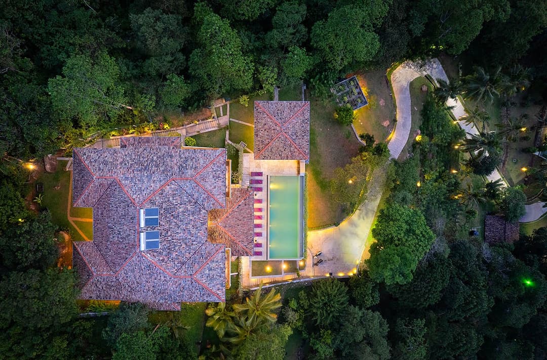 Aerial overview of Divine Villa Talpe lit at night