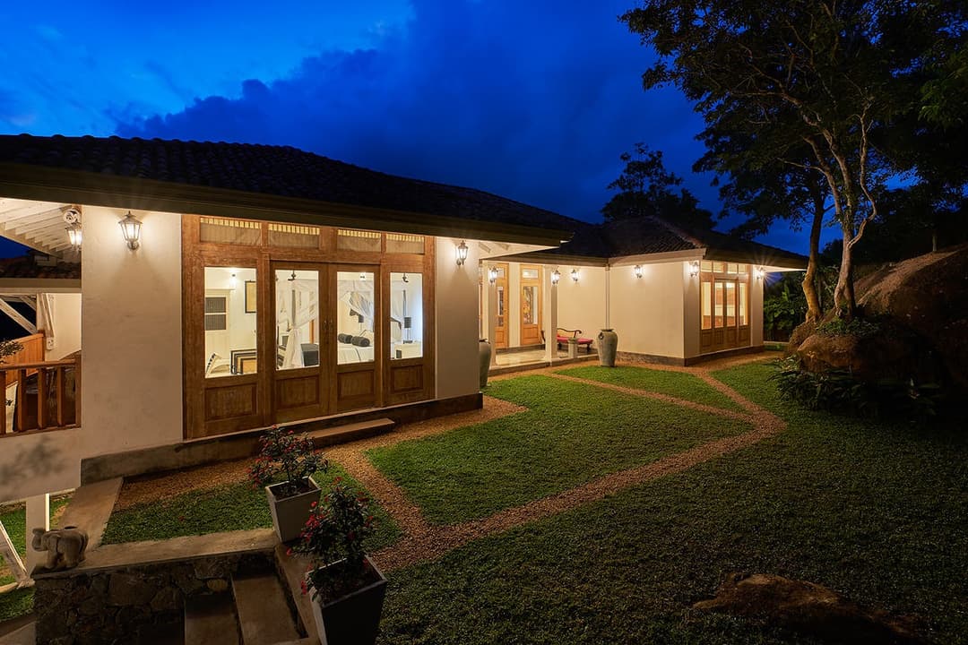 Backside garden lit at night, The Divine Villa Talpe