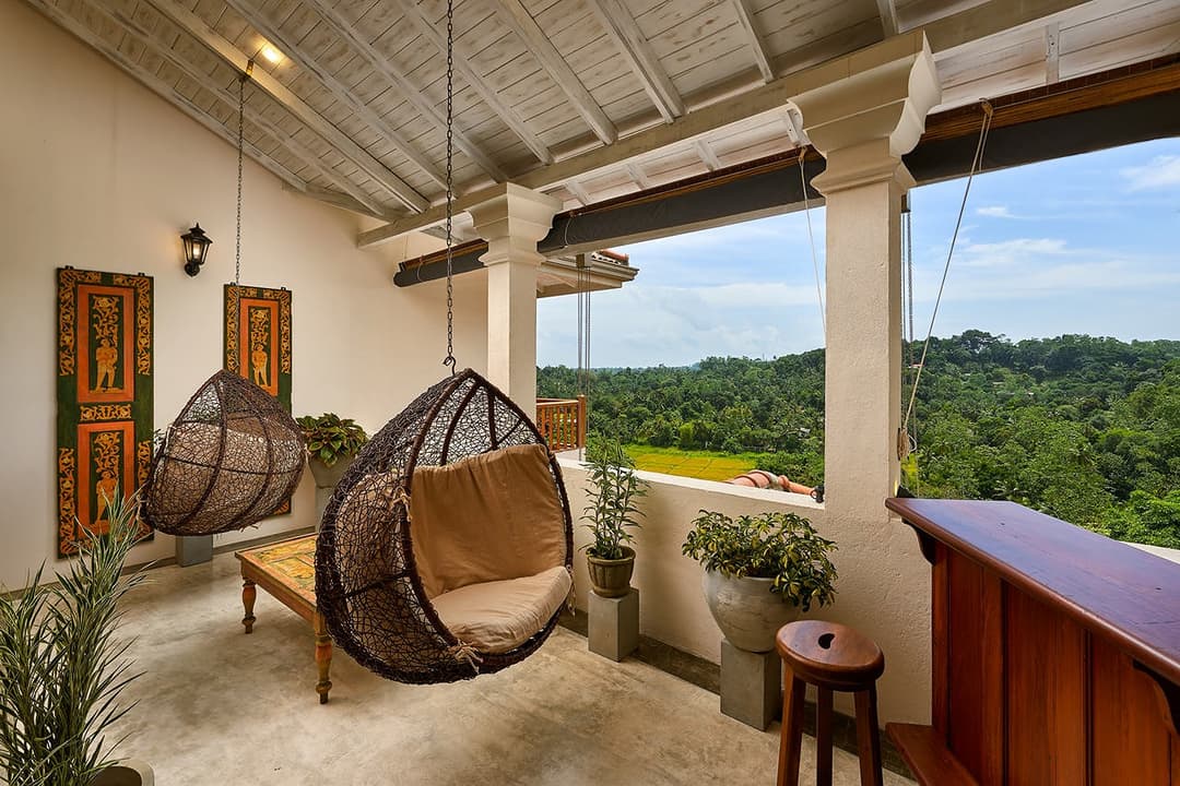 Balcony with hanging chair and forest view, Divine Villa Talpe