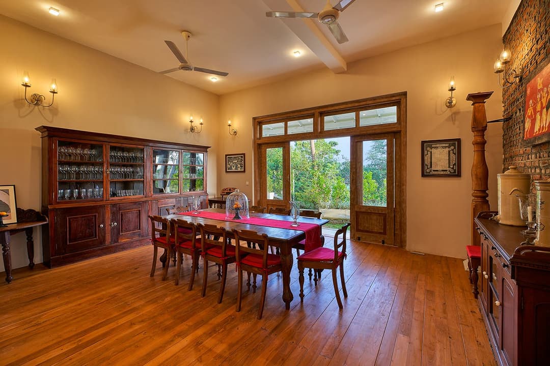 Dining room wide with red table, The Divine Villa Talpe