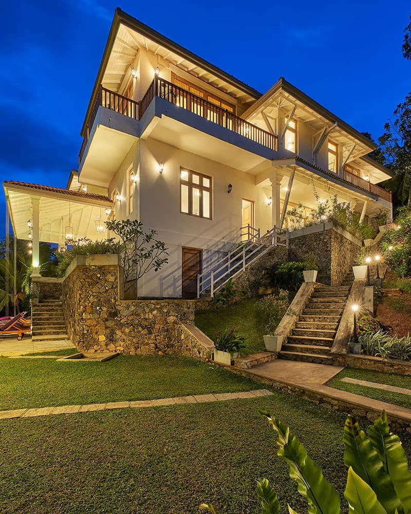 Villa exterior lit at night, The Divine Villa Talpe