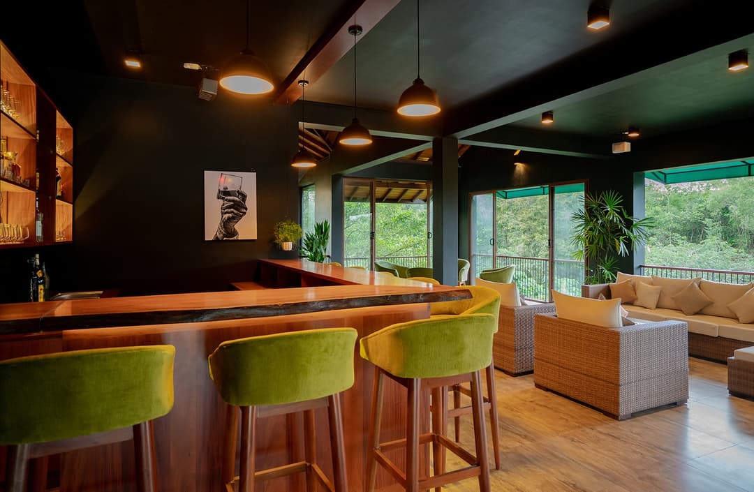 Bar with green stools and warm light, Kurokawa Kalutara