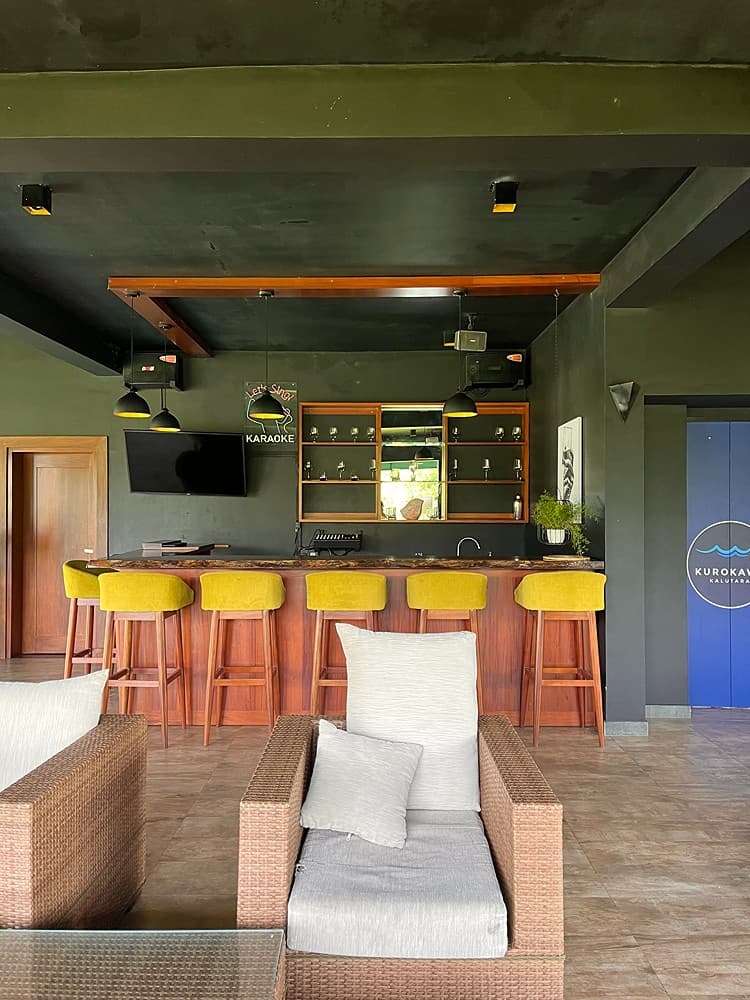 Bar with green stools and warm light, Kurokawa Kalutara