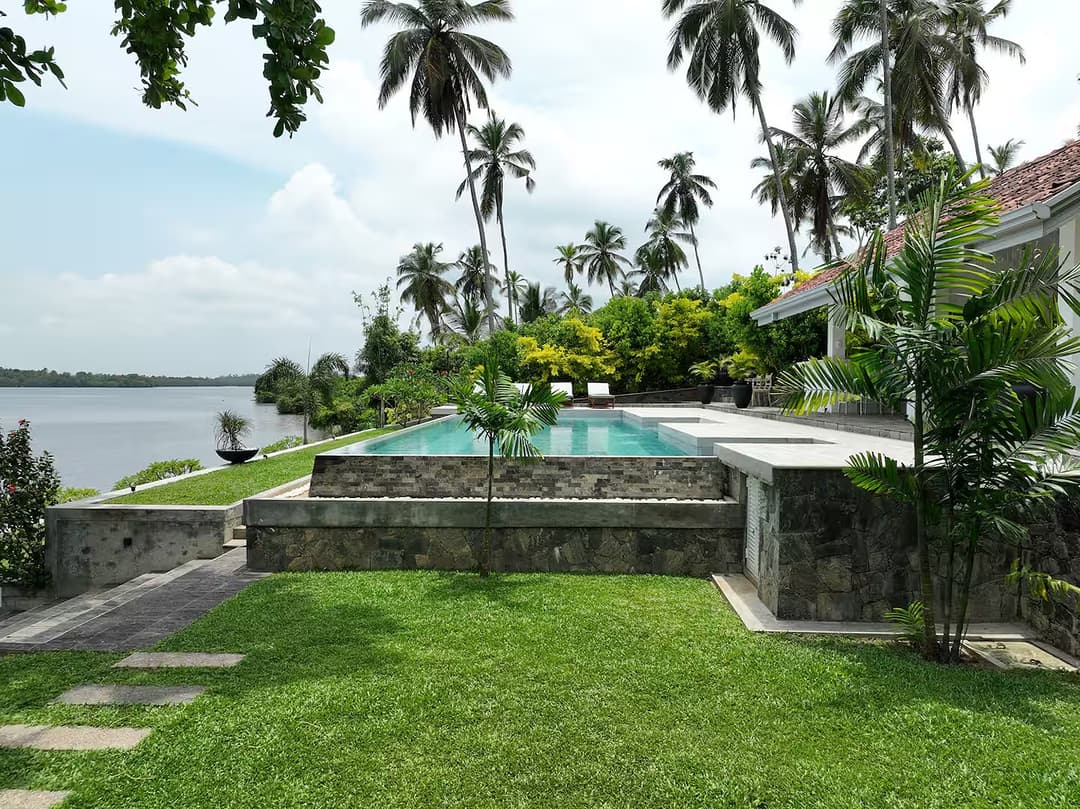 Exterior pool and garden with river, The Niche Hikkaduwa