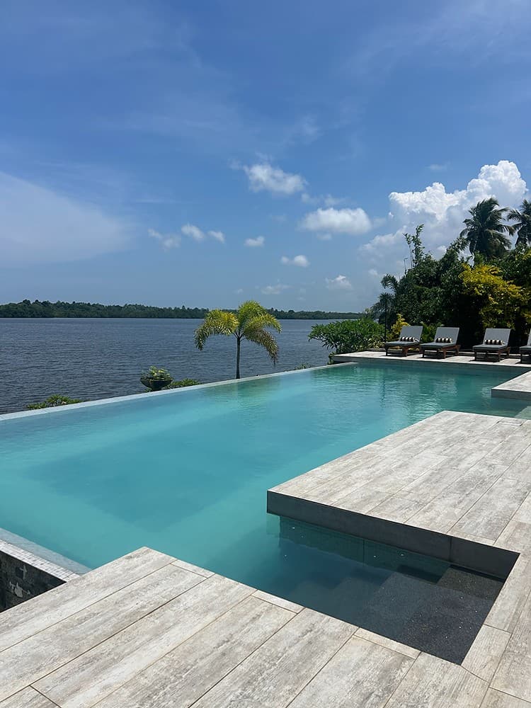 Pool view with river and loungers, The Niche Hikkaduwa