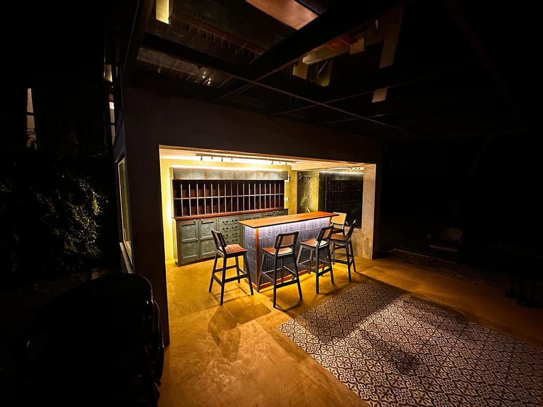 Niche Villa outdoor bar area illuminated at night
