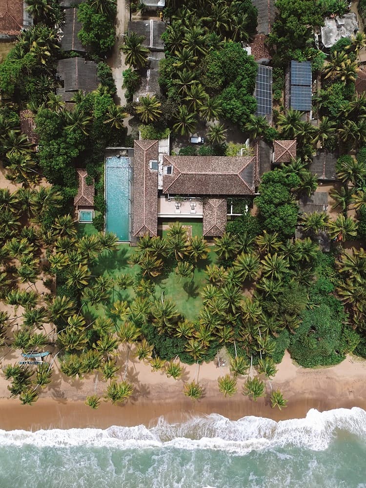 Aerial pool and beach horizon, The Villa by CC Wadduwa