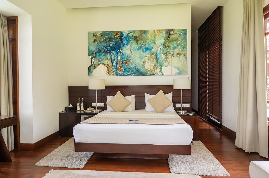 Bedroom with artwork wide angle, The Villa by CC Wadduwa
