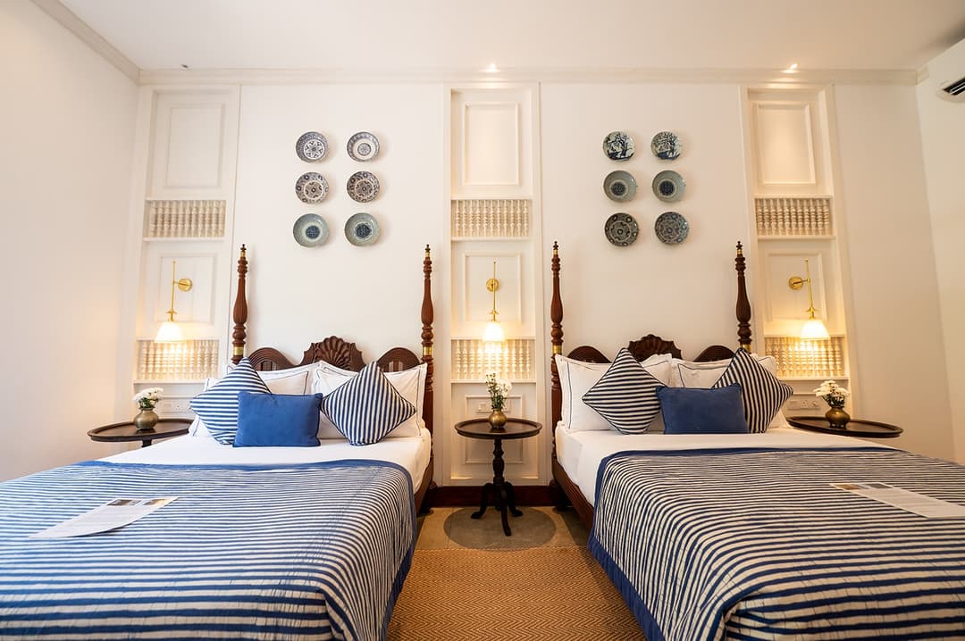 Four-poster bedroom with blue linen, The Villa by CC Wadduwa