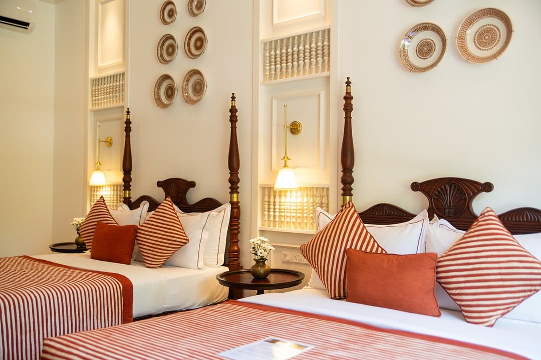 Four-poster bedroom with red linen, The Villa by CC Wadduwa