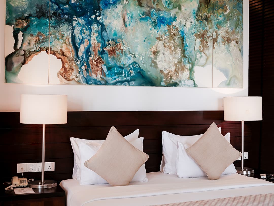 Bedroom with artwork wall, The Villa by CC Wadduwa