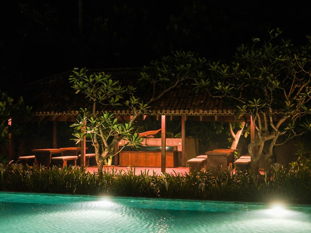 Gazebo at night with pool reflection, Villa by CC Wadduwa