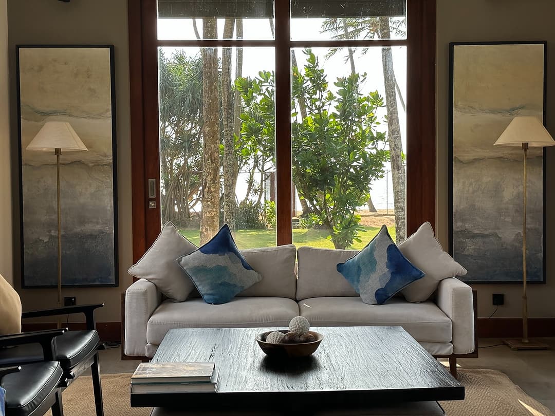 Lobby with grey sofa and garden view, The Villa by CC