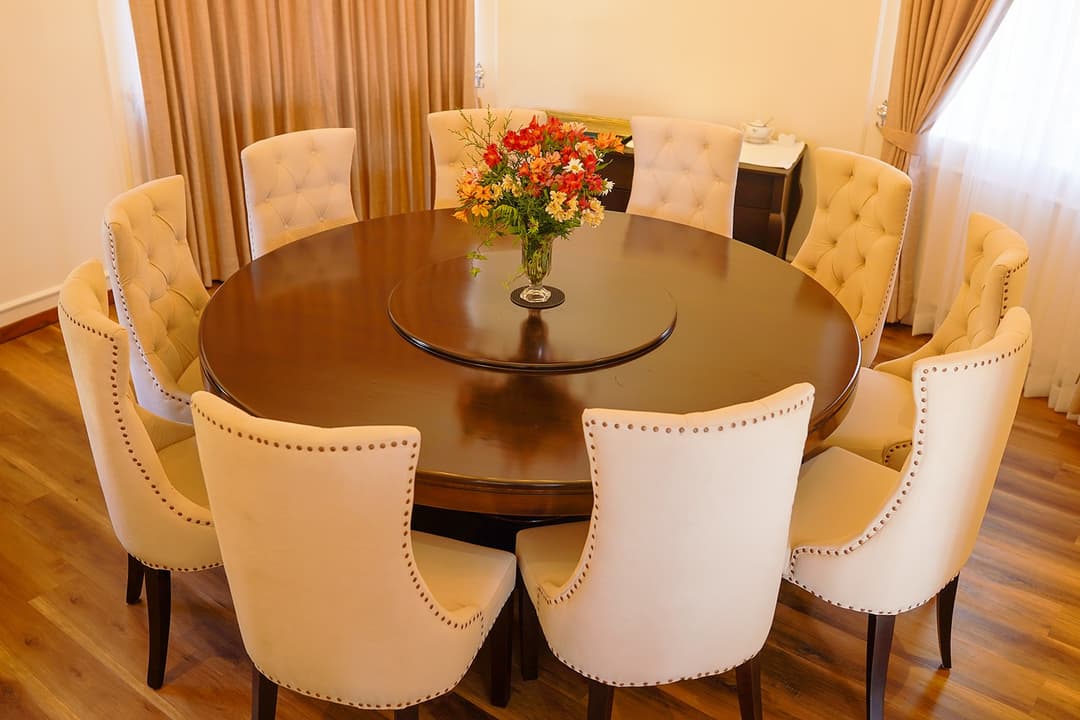 Dining room with flowers and set table, The Mystique