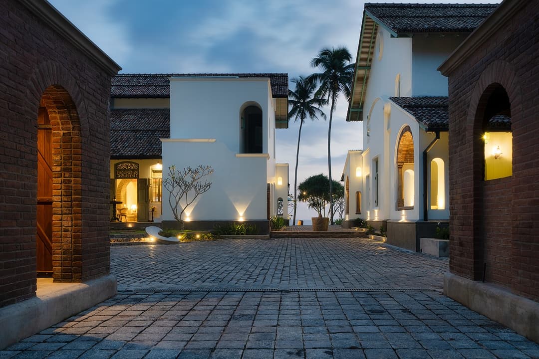 Property entrance lit in the evening, Candella House Talpe