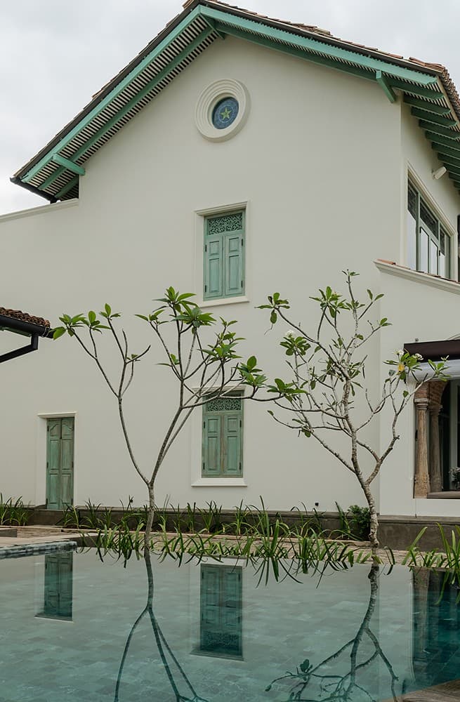 Pool view with villa facade, Candella House Talpe