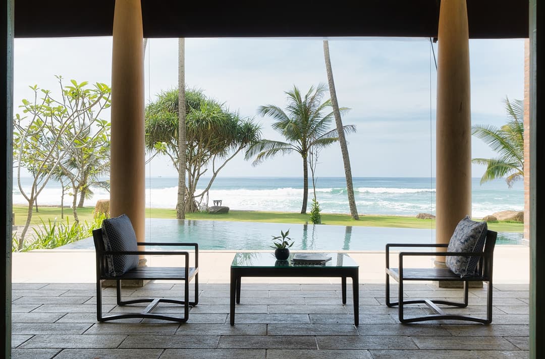 Pool terrace chairs with sea view, Candella House Talpe