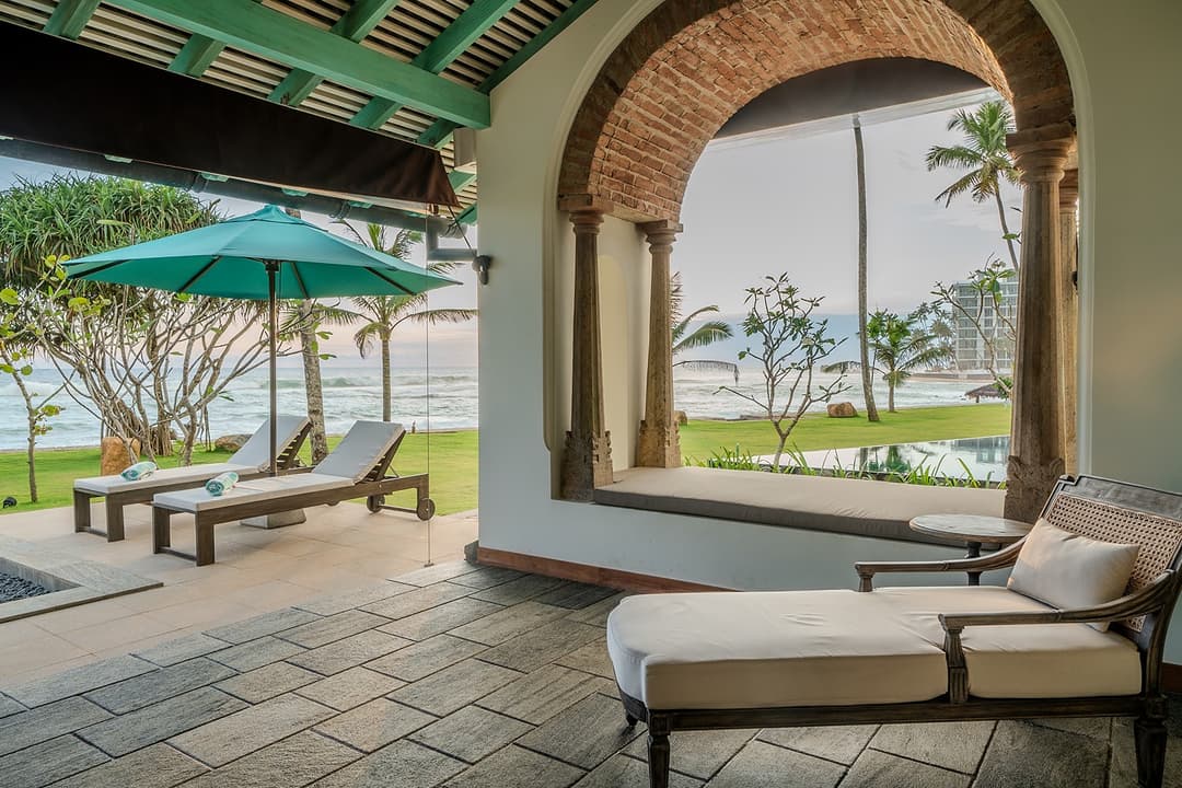 Brick arch terrace with loungers, Candella House Talpe