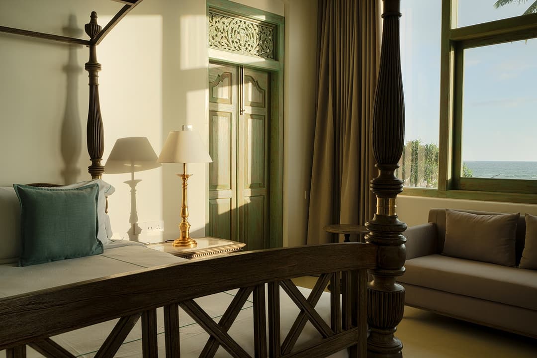 Four-poster bedroom with balcony, Candella House Talpe