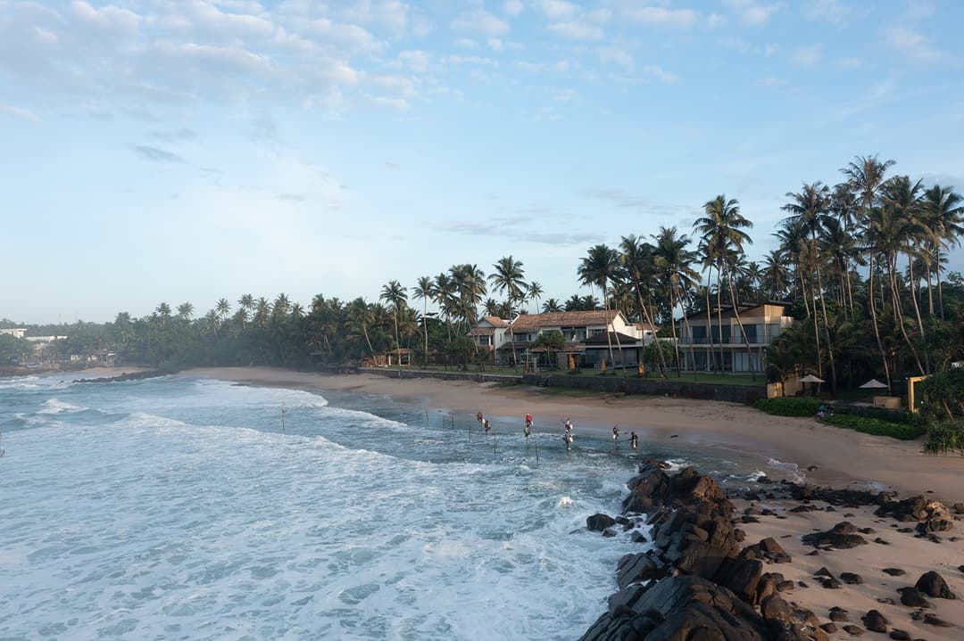 Beach and villa aerial wide, Candella House Talpe