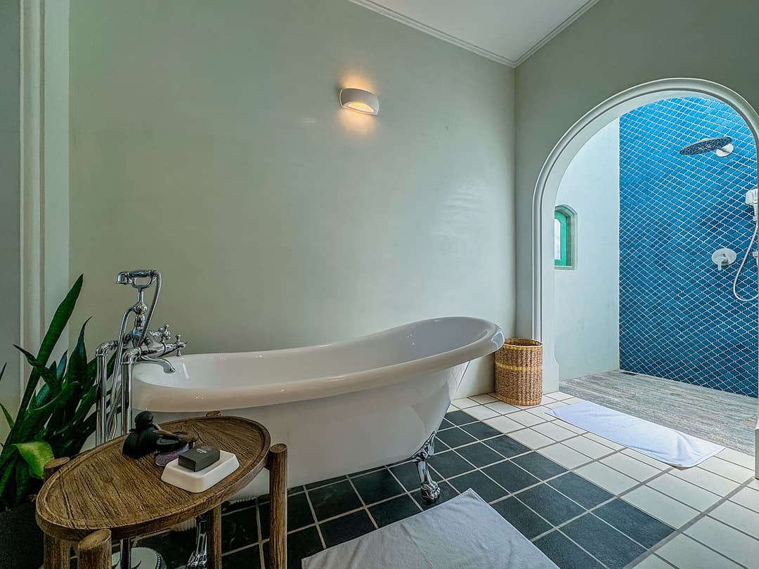 Bathroom bathtub and blue shower tiles, Candella House Talpe