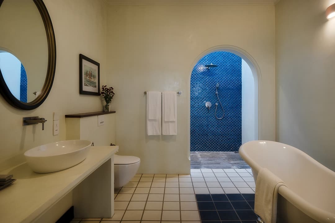 Bathroom basin with blue arched wall, Candella House Talpe
