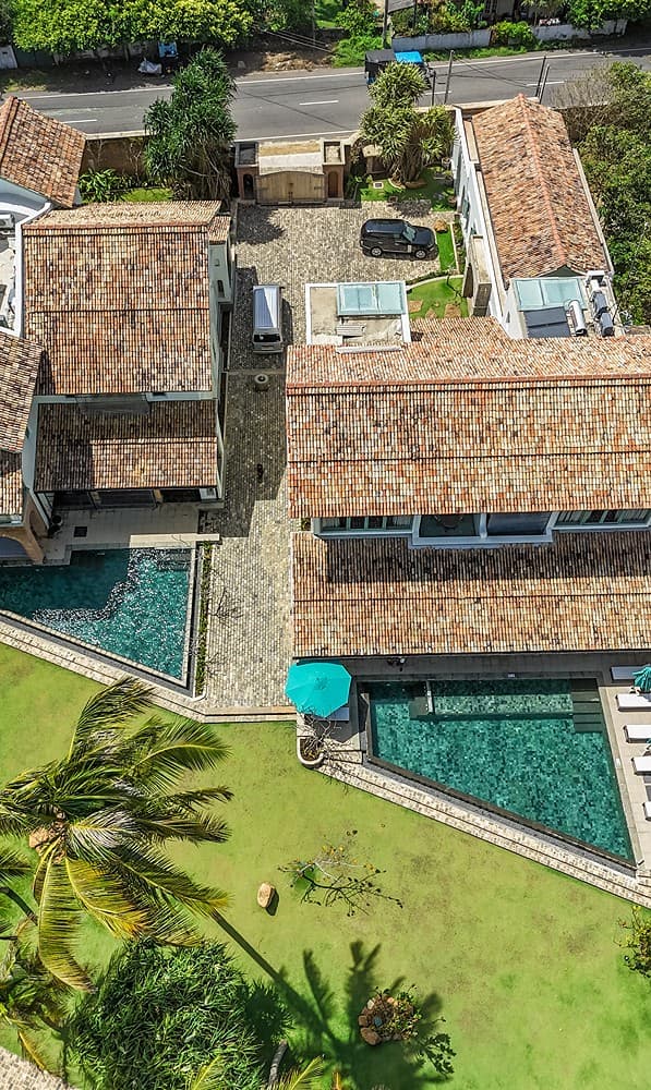 Aerial portrait villa and palms, Candella House Talpe
