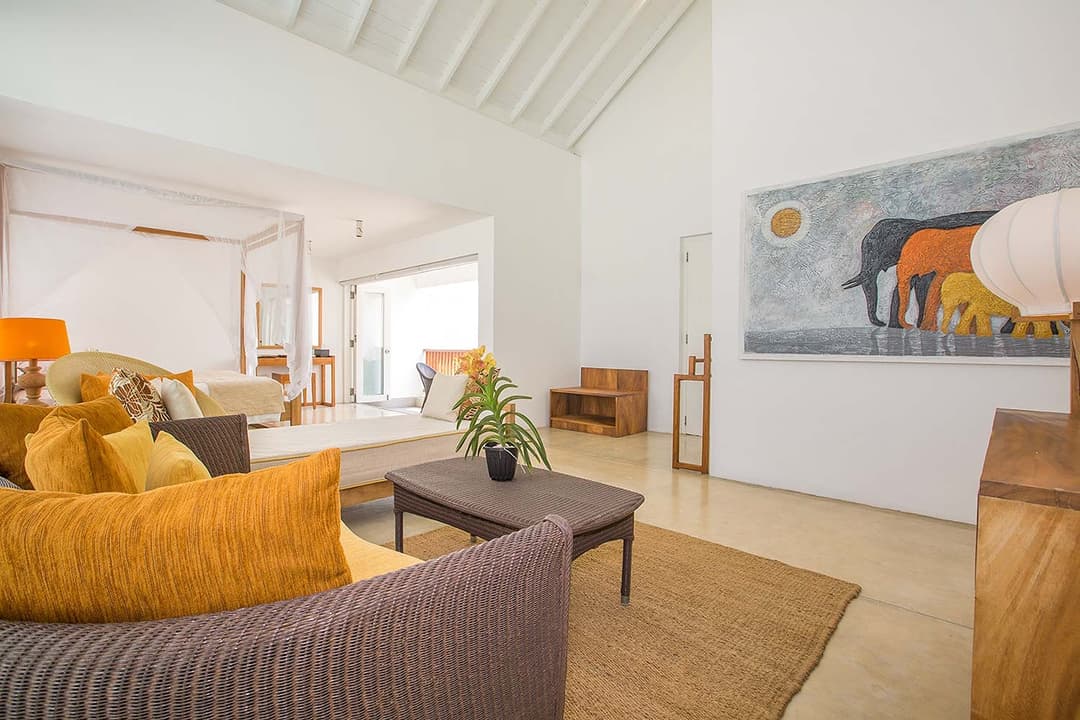 Living room with yellow sofa and art, Sri Sharavi Mirissa
