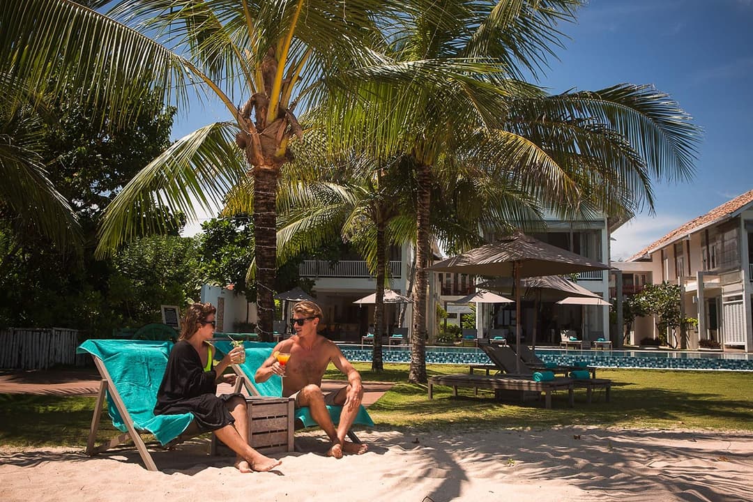 Couple on beach chairs, Sri Sharavi Beach Villas Mirissa
