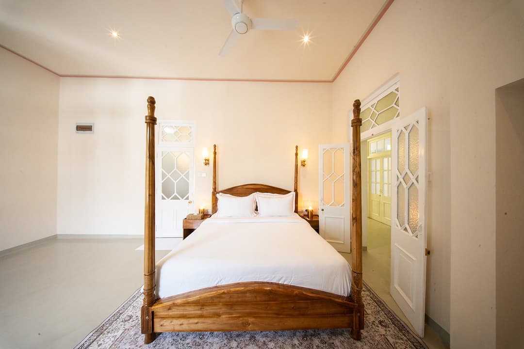 Four-poster room from doorway angle, Padmaraga Galle Fort