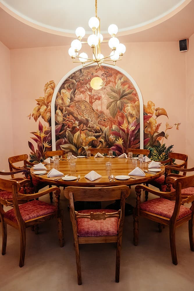 Dining room chandelier and round table, Padmaraga Galle Fort
