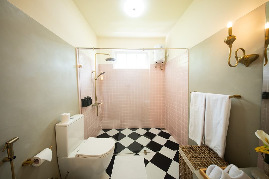 Bathroom pink tiles and shower area, Padmaraga Galle Fort