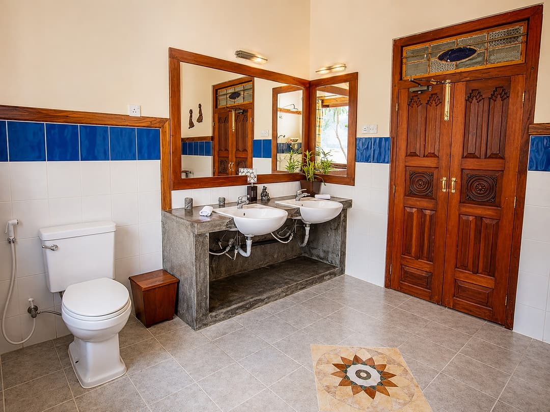 Koggala Lake bathroom with sink and wood door