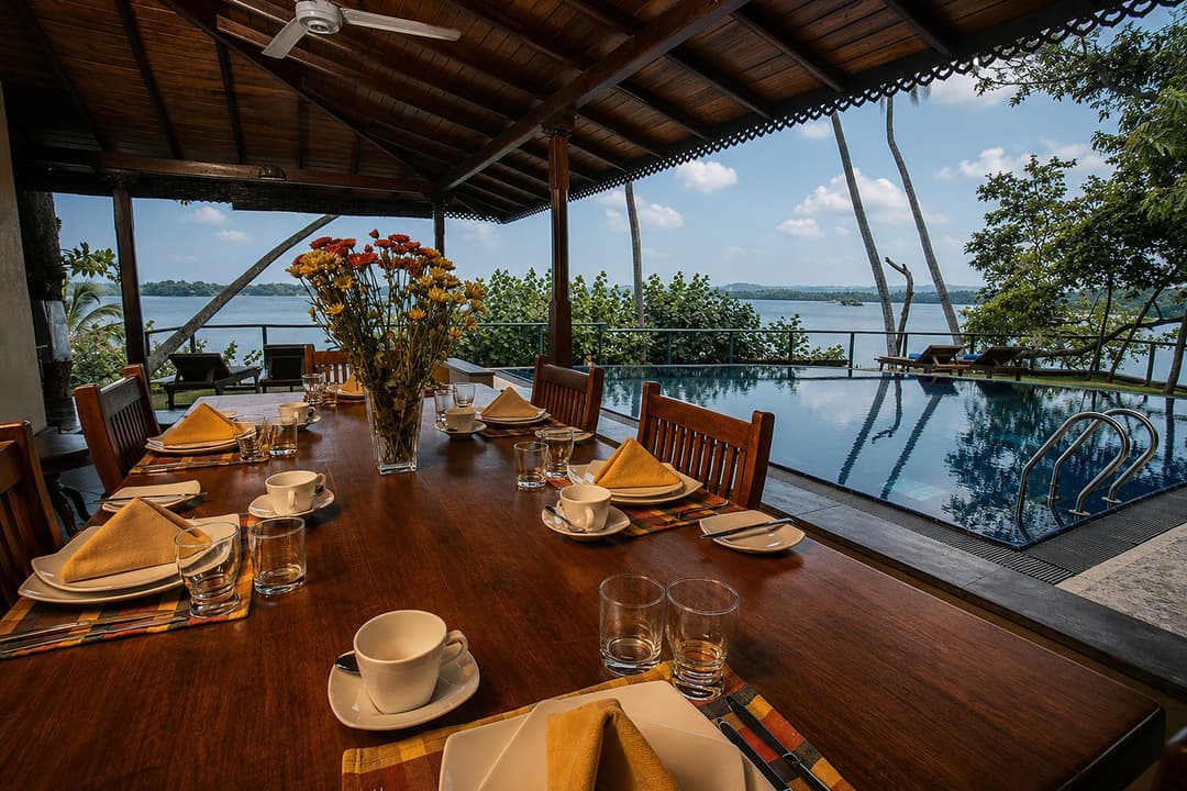 Koggala Lake dining table with pool and lake view