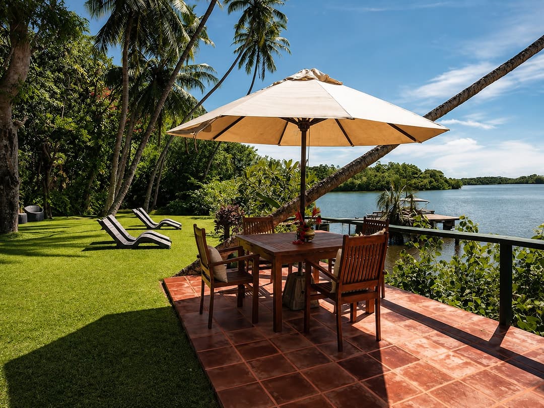 Koggala Lake garden deck with dining table and lake view