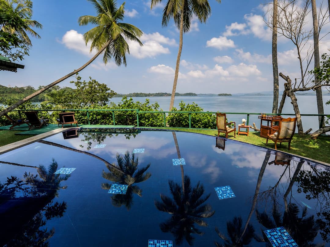 Koggala Lake infinity pool with jetty reflection