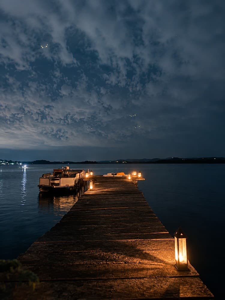 Koggala Lake candlelit dinner setting on the jetty at night