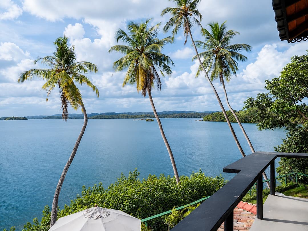 Koggala Lake view with distant jetty and palm trees