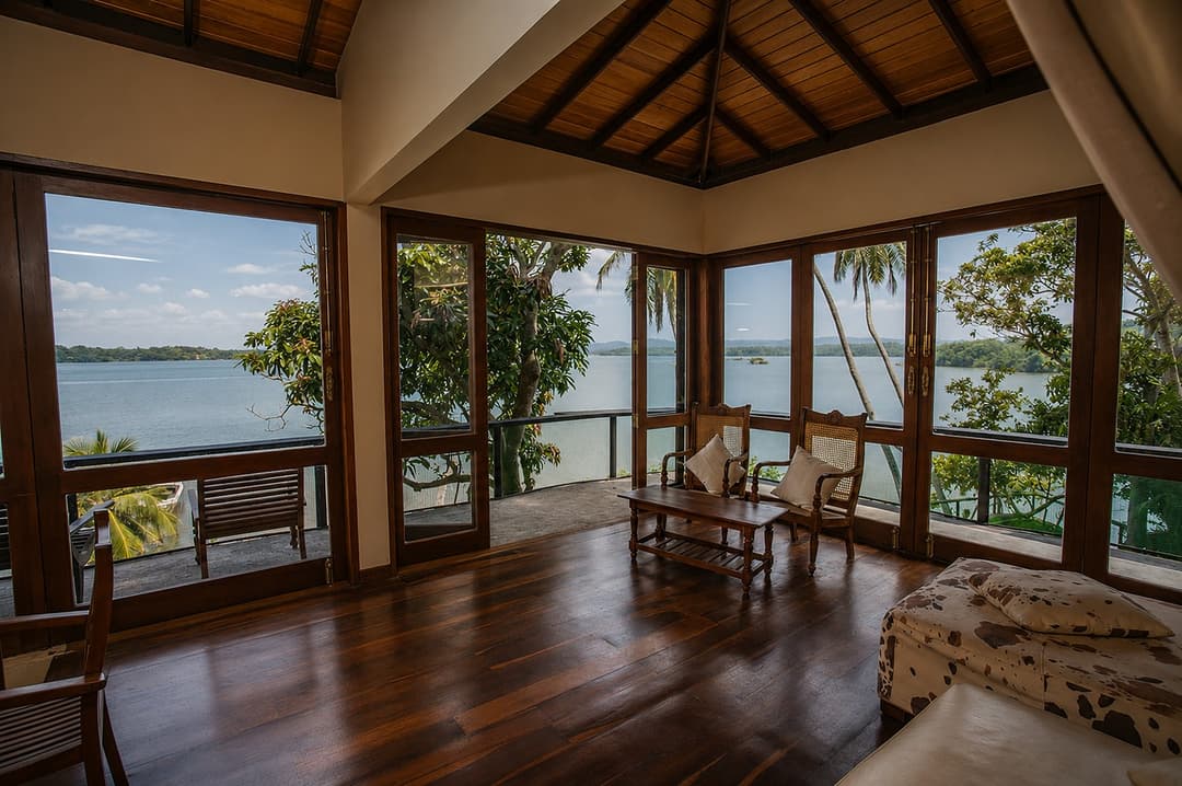 Koggala Lake living room with lake view windows