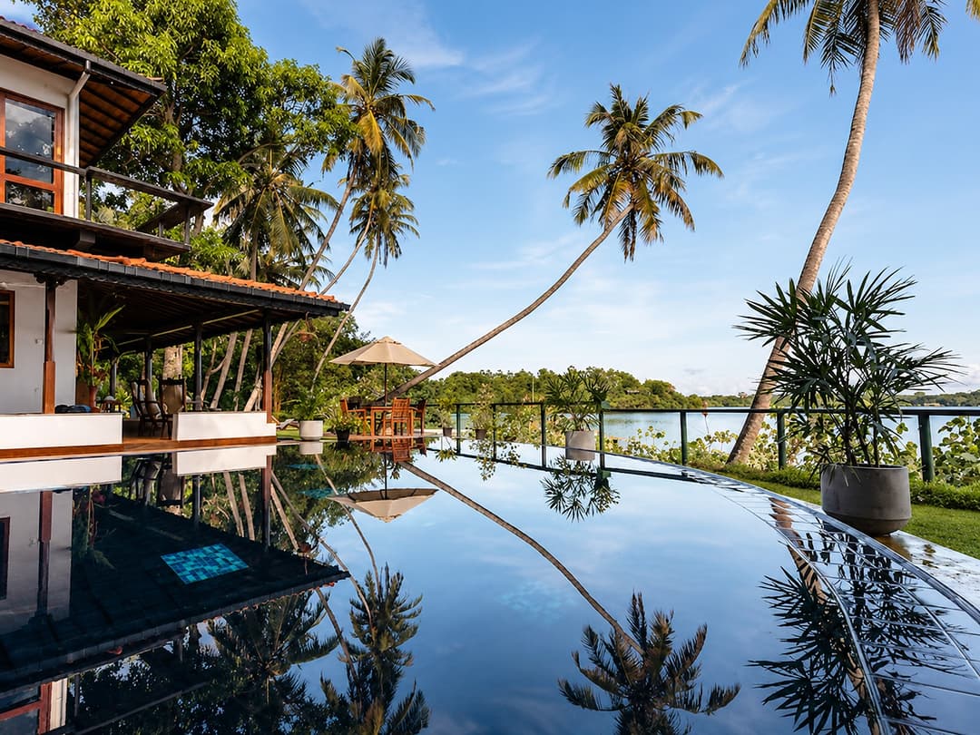 Koggala Lake pool reflecting palm trees