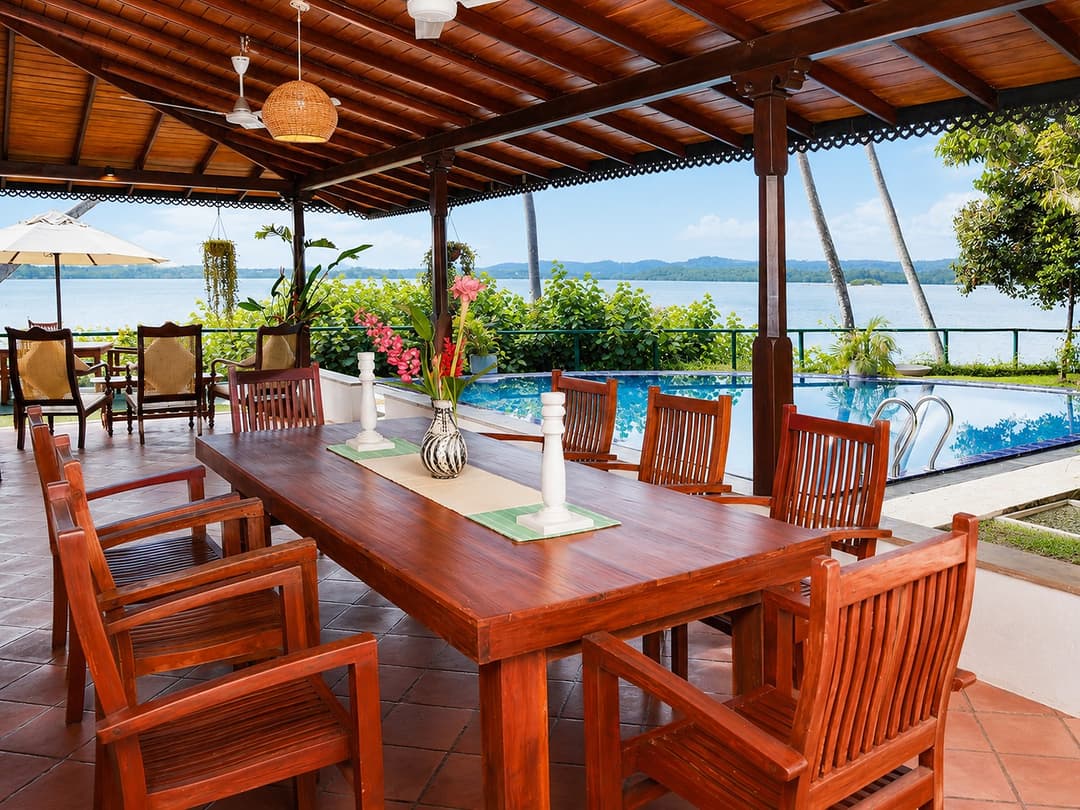 Koggala Lake veranda dining table with pool view