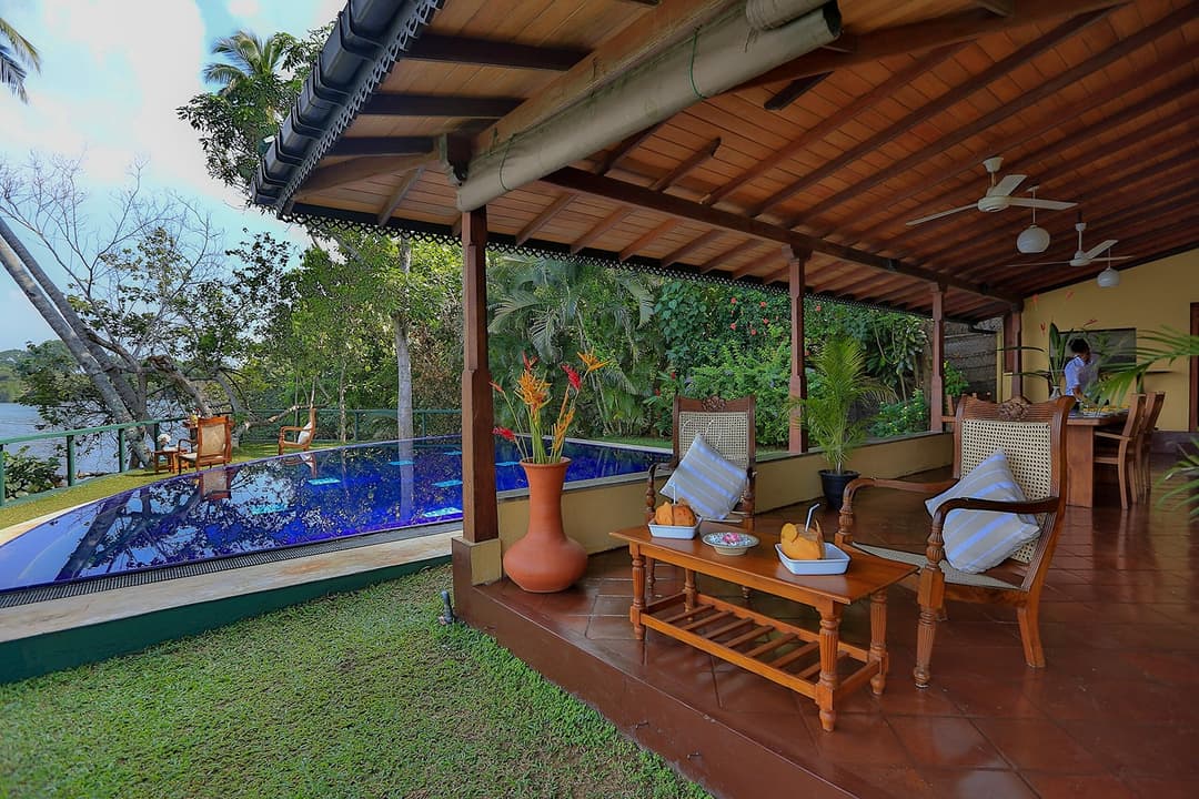 Koggala Lake veranda lounge sofa with pool view