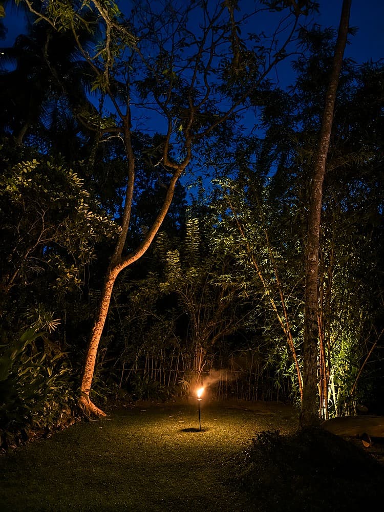 Kingfisher House Koggala tiki torch in garden dusk