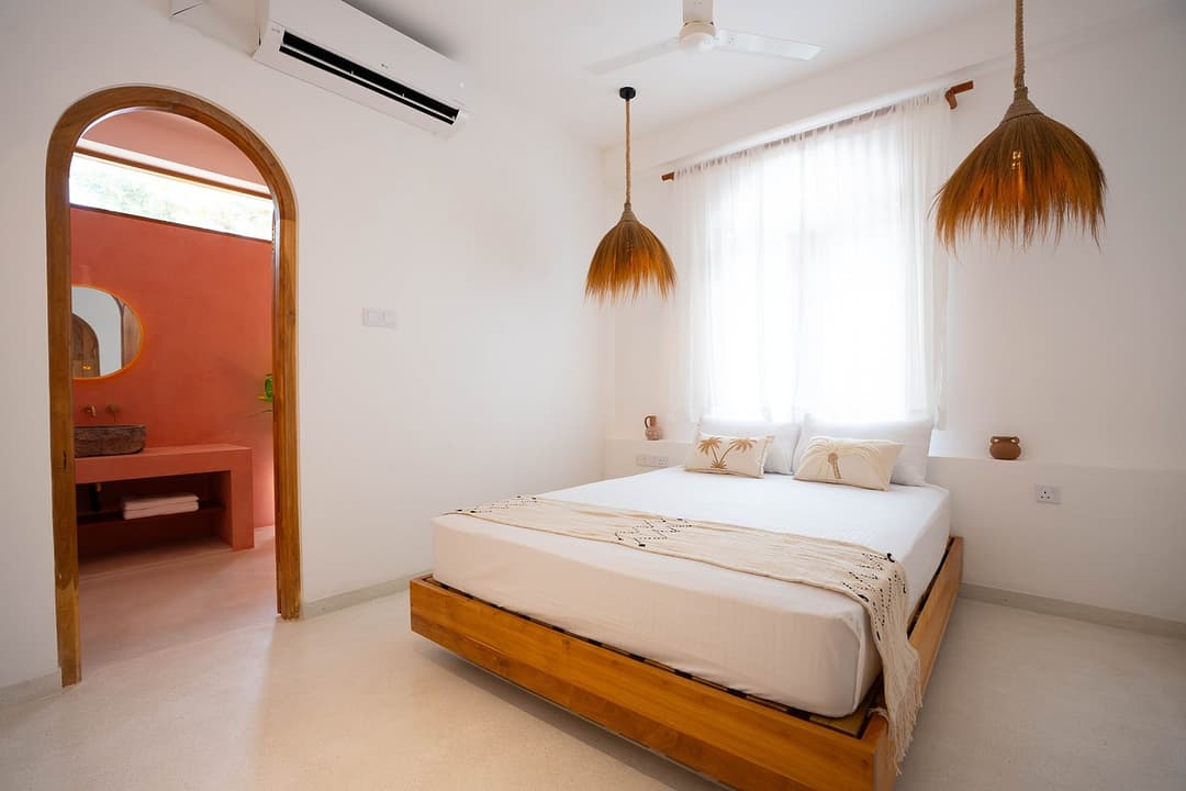 Ahangama bedroom with terracotta wall interior