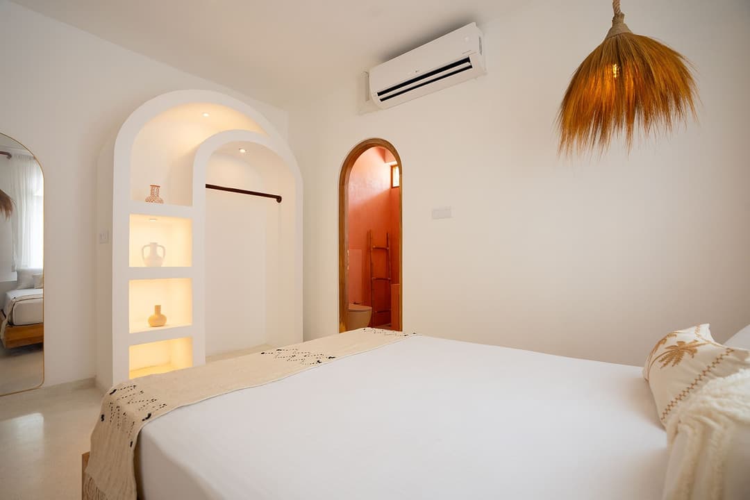 Ahangama bedroom with red accent wall interior