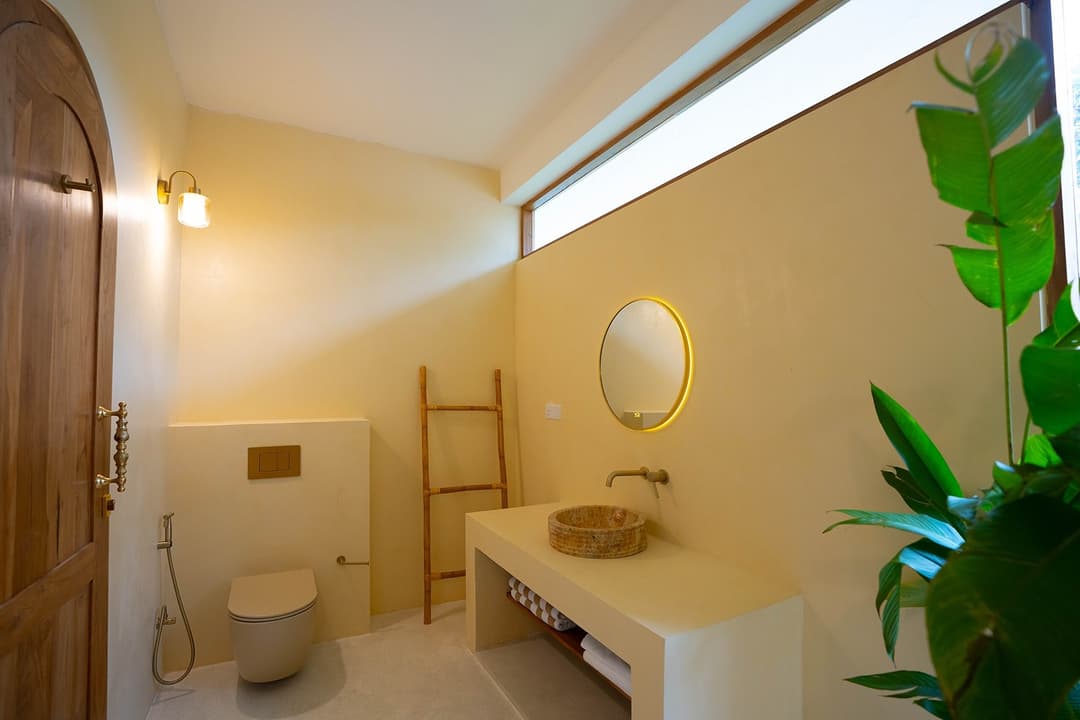 Ahangama bathroom with sink and arched shower doorway