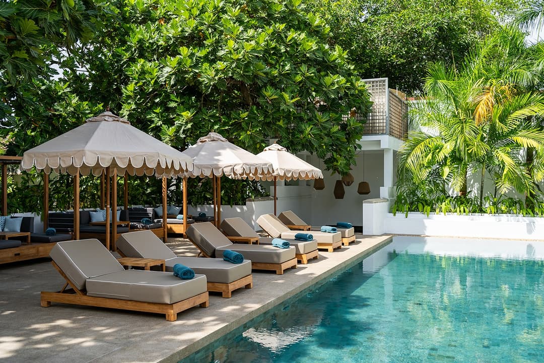 Fort Bazaar Galle pool loungers under trees