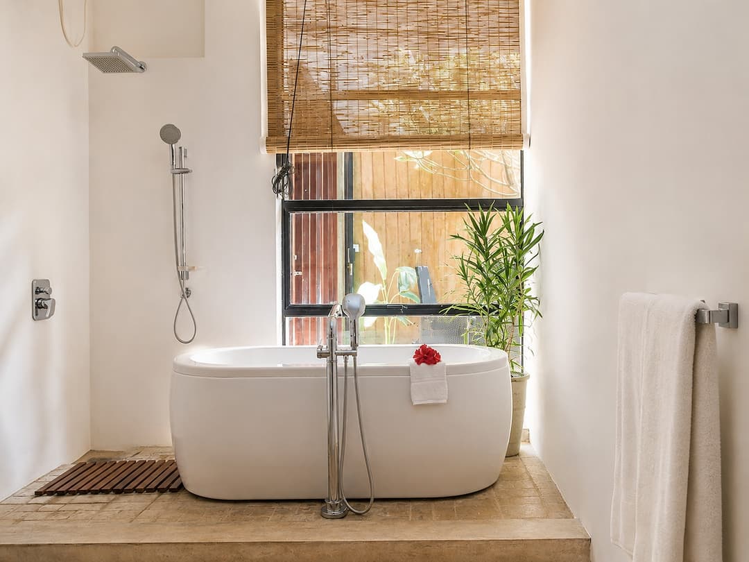 Mirissa bathroom with freestanding tub by window