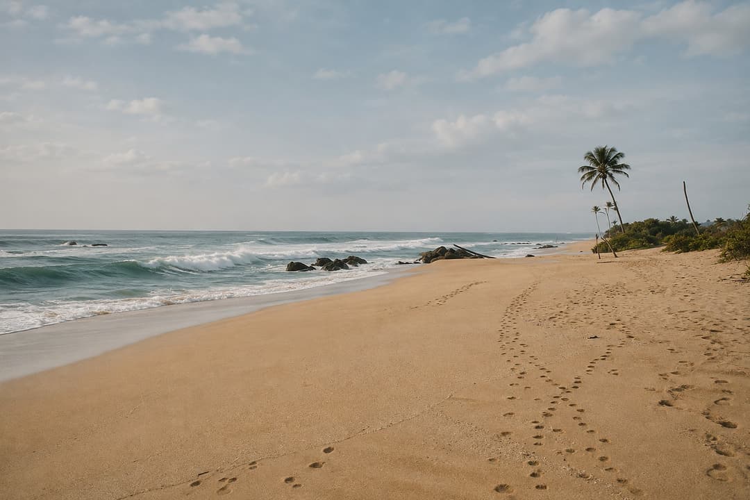 Mirissa beach with footprints in the sand