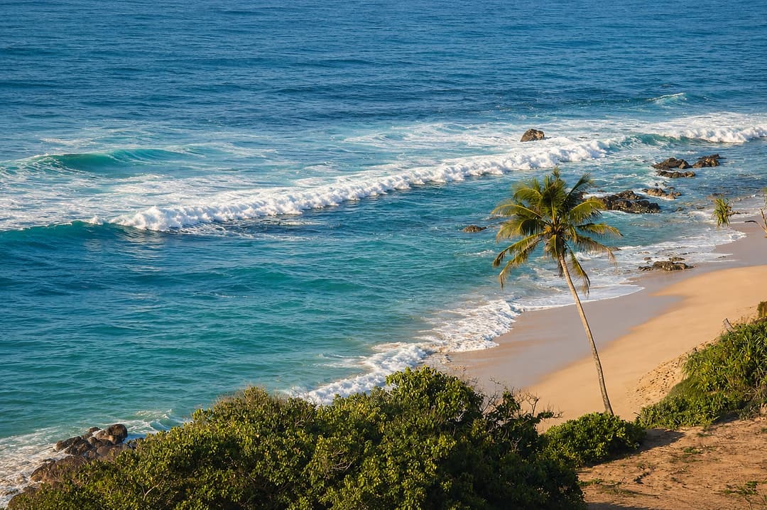 Mirissa coastal cliff with crashing waves